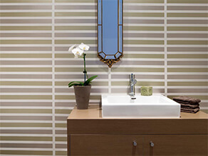 Neutral Feature Wall Bathroom with Mirror and Timber Basin and White Sink and Plant